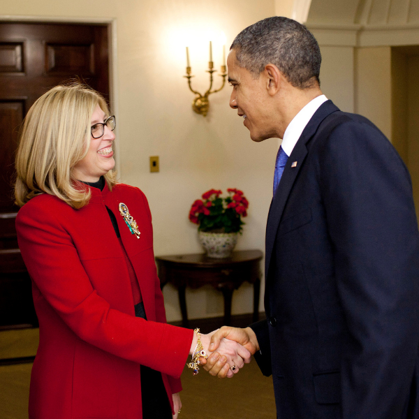 Then-President Barack Obama presents Teresa K. Woodruff with the Presidential Award for Excellence in Science, Mathematics and Engineering Mentoring in an Oval Office ceremony in 2011. Photo credit: Photo credit: Pete Souza